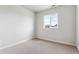 Bedroom featuring carpet, white walls, a window for natural light, and electrical outlets at 2536 Wesley Ln, Lafayette, CO 80026