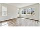 This well lit bedroom has wood floors and neutral paint with three windows at 2536 Wesley Ln, Lafayette, CO 80026