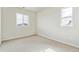Bedroom featuring carpet, white walls, windows for natural light, and electrical outlets at 2536 Wesley Ln, Lafayette, CO 80026