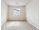 Empty bedroom with carpet, white walls, recessed lighting, and a window providing natural light at 2536 Wesley Ln, Lafayette, CO 80026