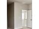 Hallway leading to another room with base trim and neutral paint at 2536 Wesley Ln, Lafayette, CO 80026