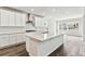Open kitchen with a center island, white cabinets and stainless steel appliances at 2536 Wesley Ln, Lafayette, CO 80026