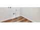 Laundry room with wood floor, hookups for washer and dryer, and clean white walls at 2536 Wesley Ln, Lafayette, CO 80026