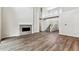 Open concept living room with a fireplace and a staircase to the second floor at 2536 Wesley Ln, Lafayette, CO 80026