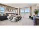 Comfortable main bedroom with an accent wall, mountain views, and plenty of natural light at 2536 Wesley Ln, Lafayette, CO 80026