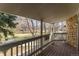 Spacious balcony overlooking a lush green park-like setting at 8335 Fairmount Dr # 3-201, Denver, CO 80247