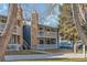 Building exterior showcasing a walkway and parking area at 8335 Fairmount Dr # 3-201, Denver, CO 80247