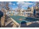 Community swimming pool with a winter cover at 8335 Fairmount Dr # 3-201, Denver, CO 80247