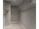 Walk-in closet with ample shelving and hanging space at 8335 Fairmount Dr # 3-201, Denver, CO 80247