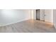 Clean, bright bedroom featuring wood-look flooring and a closet at 7335 E Quincy Ave # 104, Denver, CO 80237