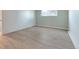 Light-filled bedroom featuring wood-look floors at 7335 E Quincy Ave # 104, Denver, CO 80237