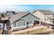 Elevated aerial view of the back of the home showing the patio and fenced yard at 3906 S Quemoy Ct, Aurora, CO 80018