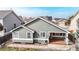 Aerial view of the rear of the house featuring a patio and fully fenced backyard at 3906 S Quemoy Ct, Aurora, CO 80018