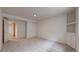 Carpeted basement featuring built-in storage cabinets and recessed lighting at 3906 S Quemoy Ct, Aurora, CO 80018