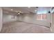 Large carpeted basement with curtains on the windows and recessed lighting at 3906 S Quemoy Ct, Aurora, CO 80018