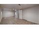 Large finished basement with a tiled floor and white walls at 3906 S Quemoy Ct, Aurora, CO 80018