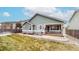 Back exterior of home with a view of the patio and yard at 3906 S Quemoy Ct, Aurora, CO 80018