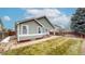 Back exterior of home, showcasing the fenced backyard and patio area at 3906 S Quemoy Ct, Aurora, CO 80018