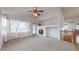 Open living room with a fireplace, lots of natural light, and stairway to the second floor at 3906 S Quemoy Ct, Aurora, CO 80018