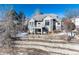 House with a backyard, deck, and stone retaining walls at 60 Golden Eagle Rd, Greenwood Village, CO 80121