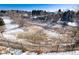 Large backyard with snow and a view of the surrounding area at 60 Golden Eagle Rd, Greenwood Village, CO 80121