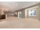 Spacious finished basement with neutral carpet and lots of natural light at 60 Golden Eagle Rd, Greenwood Village, CO 80121