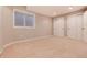 Finished basement bedroom with double closets and neutral carpeting at 60 Golden Eagle Rd, Greenwood Village, CO 80121