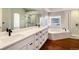 Elegant bathroom with soaking tub, double vanity, and walk-in shower at 60 Golden Eagle Rd, Greenwood Village, CO 80121