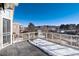 Deck overlooking a backyard and a snow covered landscape at 60 Golden Eagle Rd, Greenwood Village, CO 80121