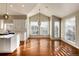 Bright kitchen with white cabinets and hardwood floors at 60 Golden Eagle Rd, Greenwood Village, CO 80121