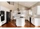 Modern kitchen with white cabinets and an island at 60 Golden Eagle Rd, Greenwood Village, CO 80121