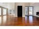 Bright living room with hardwood floors, fireplace, and large windows at 60 Golden Eagle Rd, Greenwood Village, CO 80121