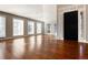 Hardwood floor living room with large windows and an open floor plan at 60 Golden Eagle Rd, Greenwood Village, CO 80121