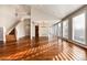 Open concept living room with hardwood floors and staircase at 60 Golden Eagle Rd, Greenwood Village, CO 80121