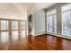 Spacious living room with hardwood floors and large windows at 60 Golden Eagle Rd, Greenwood Village, CO 80121