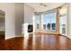 Spacious living room with hardwood floors, fireplace and large windows at 60 Golden Eagle Rd, Greenwood Village, CO 80121