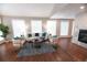 Bright living room featuring hardwood floors, fireplace, and neutral furniture set at 60 Golden Eagle Rd, Greenwood Village, CO 80121