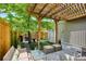 Scenic view of the backyard with a pergola patio, landscaping and a designated grilling area, perfect for entertaining at 2723 Galena St, Denver, CO 80238