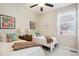 Bedroom showcasing two twin beds, bright natural light, and charming decor, creating a cozy atmosphere at 2723 Galena St, Denver, CO 80238