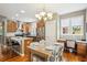 Cozy kitchen and dining area with granite counters, stainless appliances and charming decor at 2723 Galena St, Denver, CO 80238