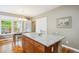 Kitchen with wood cabinets, granite island, and hardwood flooring perfect for entertaining friends and Gathering at 2723 Galena St, Denver, CO 80238