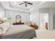 Spacious main bedroom features a tray ceiling, walk-in closet, and an ensuite bathroom at 2723 Galena St, Denver, CO 80238