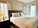 Bedroom features a cozy bed with side table and neutral colors for relaxation and comfort at 7429 S Alkire St # 205, Littleton, CO 80127