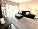 Living room with natural light, fireplace, and a comfortable sofa at 7429 S Alkire St # 205, Littleton, CO 80127