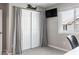 Cozy bedroom with large closet, sliding doors, gray curtains, and natural light at 9807 Arthur Ln, Highlands Ranch, CO 80130