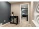 Neutral entryway featuring decorative console table and access to another room at 9807 Arthur Ln, Highlands Ranch, CO 80130