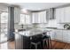 Beautiful kitchen featuring granite countertops, stainless steel appliances, and a large island with stool seating at 9807 Arthur Ln, Highlands Ranch, CO 80130