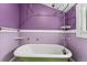 Bathroom featuring a clawfoot tub and vintage fixtures at 4461 Vrain St, Denver, CO 80212