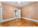Bedroom featuring hardwood floors and doorway to kitchen at 4461 Vrain St, Denver, CO 80212