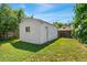 Exterior view of a one car garage with white siding and a window for natural light at 4461 Vrain St, Denver, CO 80212